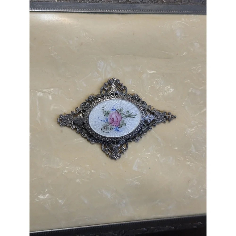 antique etched brass trinket box features a hinged lid Music Box